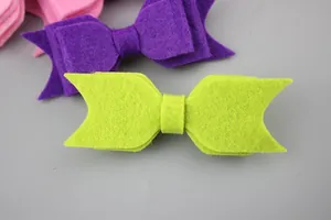 Detailed view of handmade multi-layer felt butterfly hair bows in various bright colors