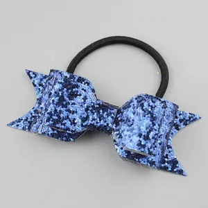 Detail of blue glitter sequin bow hair tie with elastic band for girls