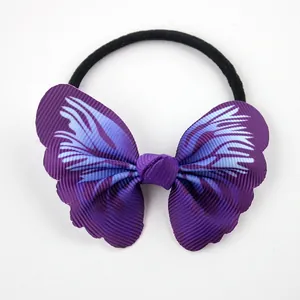 Detailed view of dark purple ribbed ribbon bow with blue print on black elastic hair tie