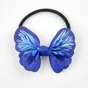 Close-up of blue textured ribbon bow hair tie with durable black elastic band