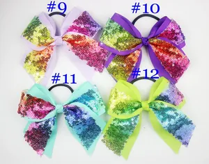 Detail view of 4-piece set sequined bow hair ties in purple, mint, and green colors