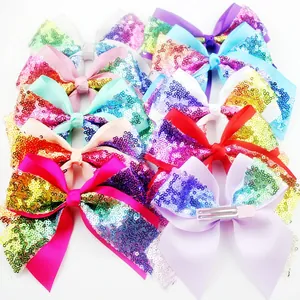 Sparkly sequin bow hair clips for girls in vibrant gradient colors with metal alligator clips