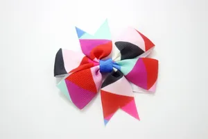 Close-up of rainbow geometric print grosgrain ribbon bow hair clip for girls