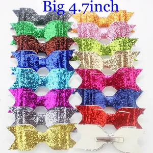 Set of 4.7-inch glitter fabric hair bow clips in sixteen assorted vibrant colors