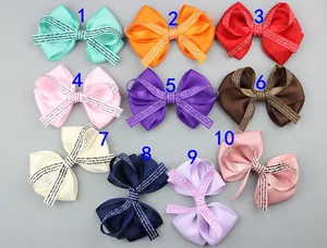 Set of 10 colorful grosgrain ribbon hair bows with decorative letter printed centers