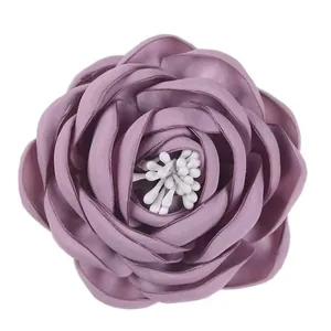 Elegant purple silk flower brooch handmade peony accessory with white stamens on white background