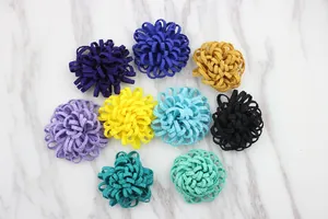 Flat lay of colorful 3.5cm handmade fabric flowers in 9 colors on marble background