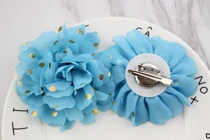 Light blue chiffon flower brooch with gold foil dots and dual metal clip backing
