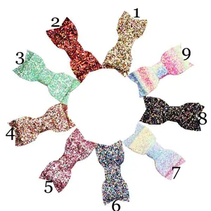 Set of 9 glitter sequin bow hair clips for girls in various sparkling colors