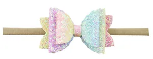 Detail van glitter gelaagde strik hoofdband met verloopkleuren en elastische nylon band