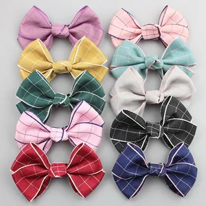 Detailed set of 10 plaid patterned bow hair clips in various vibrant colors for girls