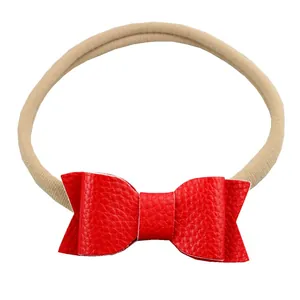 Soft nylon baby headband with a red textured leather swallowtail bow for newborns