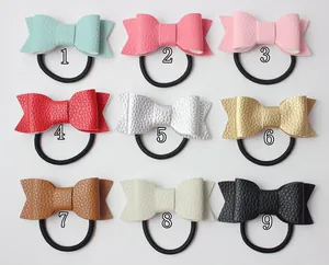 Set of 9 soft faux leather bow hair ties in multiple colors with elastic bands