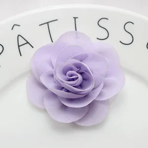 Detail of 6cm purple chiffon fabric flower with double layers and pearl center