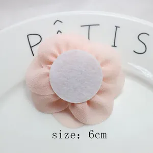 Detailed back view of a 6cm pink chiffon flower with a white felt base for DIY crafts