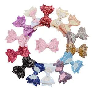 Glittery angel wing bow hair accessories set in assorted vibrant colors on white background