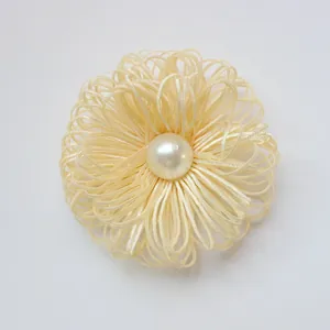 Handmade cream ribbon flower accessory with large pearl center for DIY clothing and hair