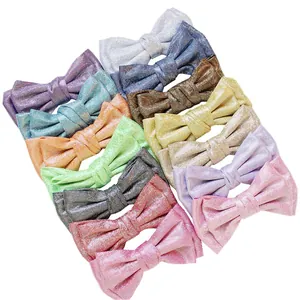 Set of 12 colorful glitter bow hair clips for girls in various sparkling vibrant shades