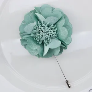 Elegant mint green fabric flower brooch with pearls and long silver pin for dress