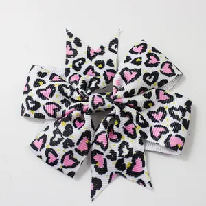 Fiocco per capelli per bambine in nastro grosgrain con stampa leopardata e cuore a coda