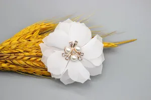 Detailed view of 6cm white chiffon flower hair accessory with pearls and crystal rhinestones