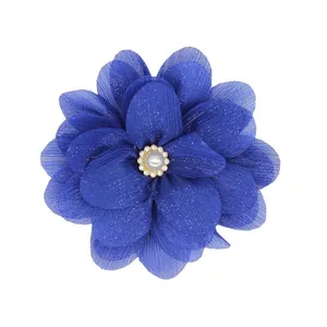 Detail of dark blue chiffon flower accessory with pearl center and sparkling sequins