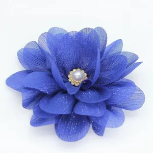 Navy blue chiffon flower hair clip with pearl and rhinestone center on white background