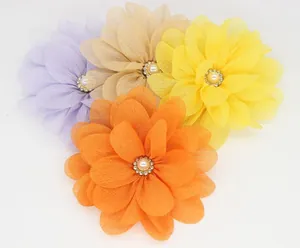 Macro shot of 4 chiffon fabric flowers with layered petals, faux pearls and rhinestones