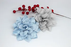 Detail of 3D fabric flower clips in blue and grey plaid for hair styling or beach decor