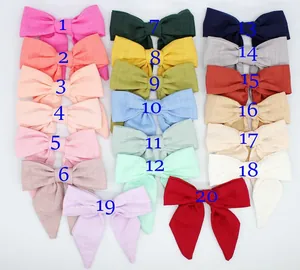 Set di 20 fiocchi elastici per capelli in tessuto colorato per bambine in toni pastello