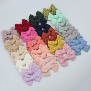 Set of 20 assorted linen fabric bow hair accessories for girls and infants in various colors