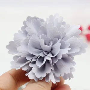 Close-up of a 7cm handmade grey pleated satin fabric flower for DIY clothing and hat decor