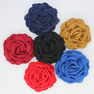 Detailed macro view of 9cm handmade fabric rose flowers in six vibrant colors