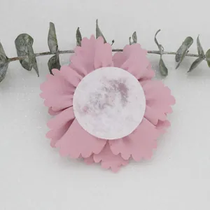 Back view of a 7cm pink fabric flower with a round white felt base for DIY crafts