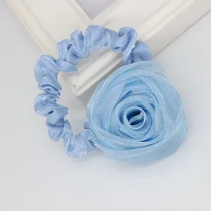 Elegant light blue satin rose scrunchie with layered organza petals for women