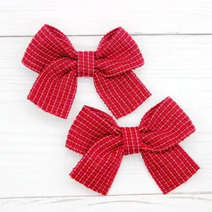Set of two red plaid bow hair clips for girls with cute checkered fabric design