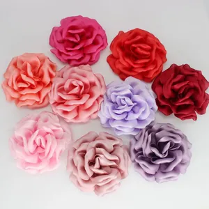Detailed top view of nine colorful 10cm handmade silk roses for wedding craft accessories
