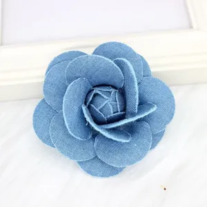Elegant denim camellia flower brooch and hair clip for suits with textured blue fabric