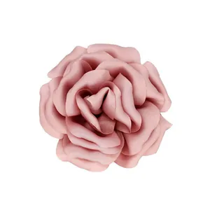 Macro shot of 10cm dusty pink satin flower brooch showing layers and fabric texture