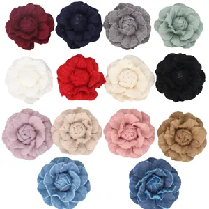 Detailed grid view of assorted denim and fabric camellia flowers for DIY hair accessories