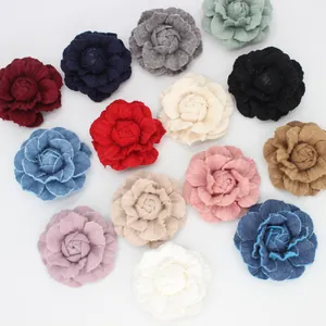 Flat lay of colorful French vintage denim and fabric camellia flower accessories
