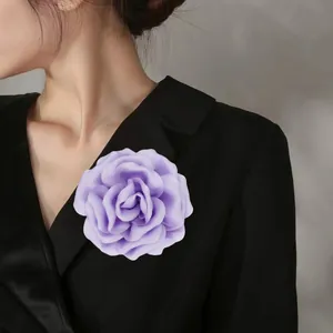 Elegant 10cm light purple satin fabric rose brooch pinned on a black suit lapel