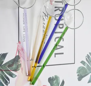 Macro view of colorful heat-resistant glass spoons with slender handles and pouring spouts