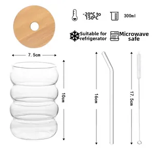 Detail of 300ml borosilicate glass rippled cup set with wooden lid and glass straw