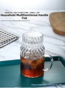 Close-up of heat-resistant glass cup with vertical stripes and handle for hot tea