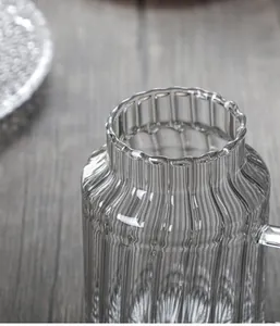 Detail of hand-blown grey striped glass cup with smooth rim and seamless one-piece molding