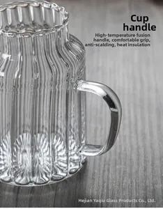 Macro detail of heat-resistant glass cup with vertical stripes and ergonomic handle