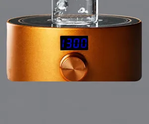 Close-up of glass cup heating base with 1300W LED display and control knob detail