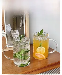 Close-up of 1000ml glass tea cup with handle showing refreshing juice and clear texture