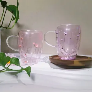 Insulated double-walled glass mugs with real dried pink flowers and elegant handles